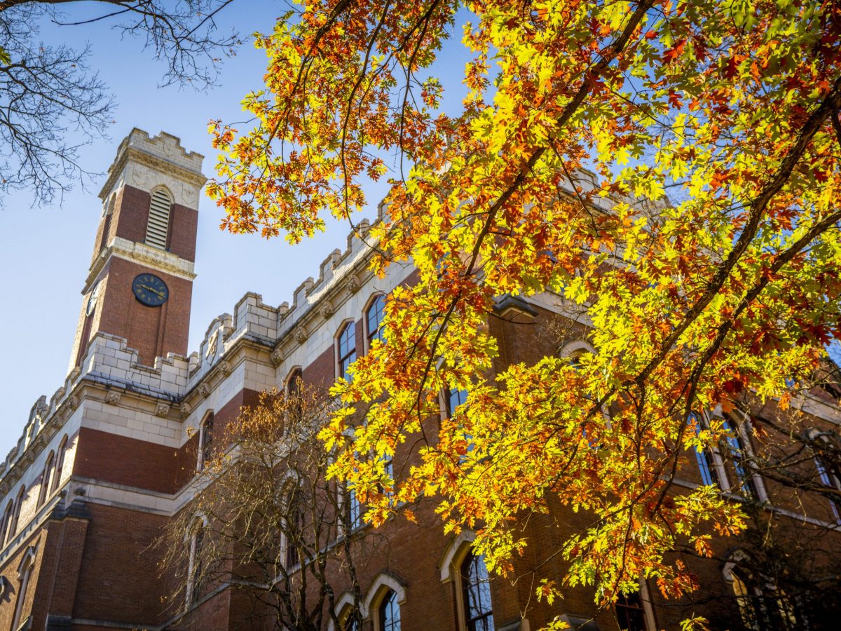 Kirkland Hall with fall leaves in foreground