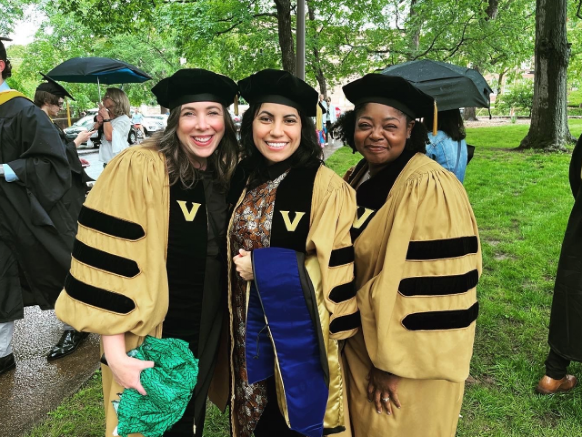 women in cap & gowns